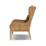A timeless silhouette reimagined in a new way. Wrapped in high performance fabric, this wingback chair offers a rich, coffee-brown depth highlighted by delicate, linen flecks with natural highs and lows. Woven back and aged oak add beautiful character.As fans of organic modern design at Amethyst, we love the warm modern inspired Vestavia Chair. Amethyst Home provides interior design, new home construction design consulting, vintage area rugs, and lighting in the Tampa metro area.