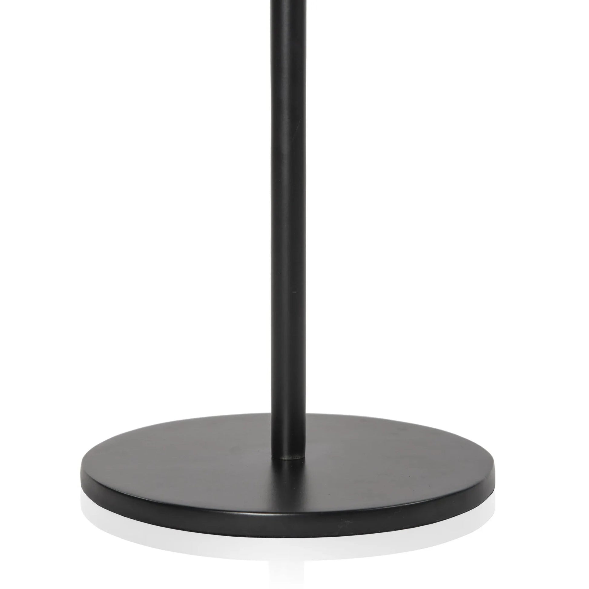 A slim-profile end table pairs a simple iron base with an oval tabletop of hand-cast recycled glass in a soft, smoky blue Amethyst Home provides interior design, new home construction design consulting, vintage area rugs, and lighting in the Portland metro area.