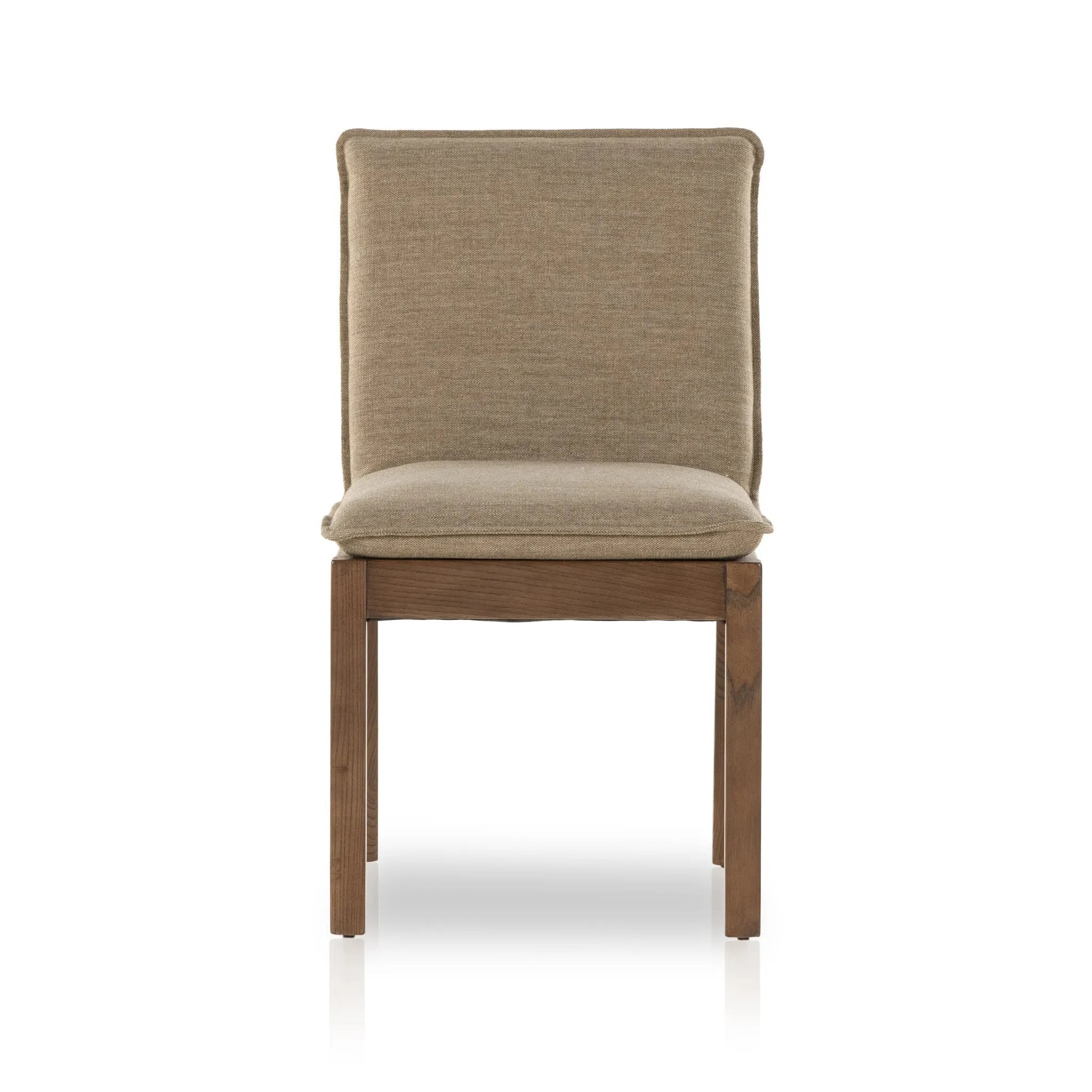 Inspired by the folded pillow form, the seat and back cushions of this parawood dining chair are covered in performance fabric. The chair back features leather strap details for a mixed material touch Amethyst Home provides interior design, new home construction design consulting, vintage area rugs, and lighting in the Salt Lake City metro area.