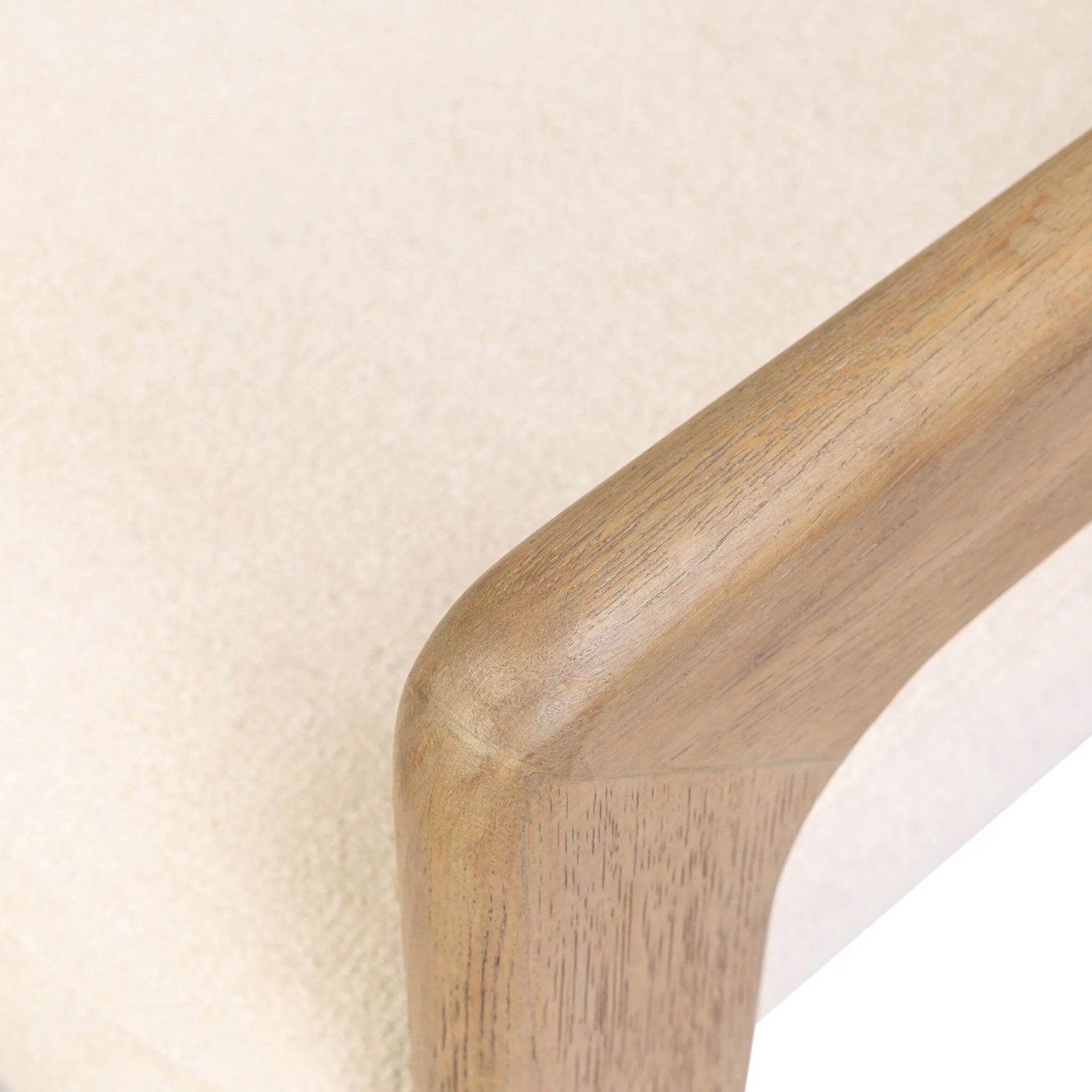 Striking from every view. This statement-making chair combines beautiful natural oak in tripod form with high-performance fabric. The cantilever design, with a wide plank back and sloping arms, form an eye-catching silhouette for the floating seat and overflowing back cushion. Amethyst Home provides interior design, new home construction design consulting, vintage area rugs, and lighting in the Calabasas metro area.
