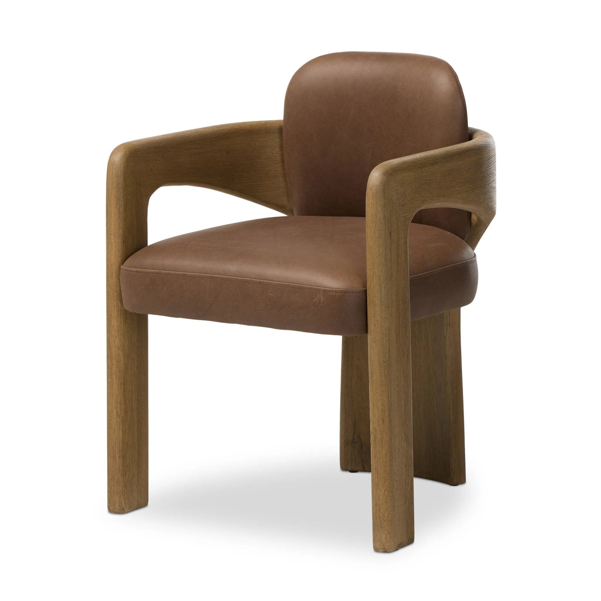 Striking from every view. This statement-making dining chair combines solid oak in tripod form with top-grain leather. The cantilever design, with a wide plank back and sloping arms, form an eye-catching silhouette for the floating seat and overflowing back cushion. Amethyst Home provides interior design, new home construction design consulting, vintage area rugs, and lighting in the Laguna Beach metro area.