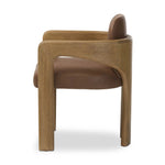 Striking from every view. This statement-making dining chair combines solid oak in tripod form with top-grain leather. The cantilever design, with a wide plank back and sloping arms, form an eye-catching silhouette for the floating seat and overflowing back cushion. Amethyst Home provides interior design, new home construction design consulting, vintage area rugs, and lighting in the Miami metro area.