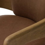 Striking from every view. This statement-making dining chair combines solid oak in tripod form with top-grain leather. The cantilever design, with a wide plank back and sloping arms, form an eye-catching silhouette for the floating seat and overflowing back cushion. Amethyst Home provides interior design, new home construction design consulting, vintage area rugs, and lighting in the Nashville metro area.