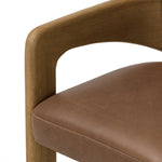 Striking from every view. This statement-making dining chair combines solid oak in tripod form with top-grain leather. The cantilever design, with a wide plank back and sloping arms, form an eye-catching silhouette for the floating seat and overflowing back cushion. Amethyst Home provides interior design, new home construction design consulting, vintage area rugs, and lighting in the Park City metro area.