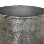 Futuristic-like metal with an antiqued finish, shaped into a cast planter with textural movement that catches the light. Safe for any space, indoor or out. Cover or store indoors during inclement weather and when not in use.As enthusiasts of natural style at Amethyst, we love the designer inspired Zavia Metal Planter - Raw Antique Nickel. Amethyst Home provides interior design, new home construction design consulting, vintage area rugs, and lighting in the Charlotte metro area.