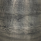 Futuristic-like metal with an antiqued finish, shaped into a cast planter with textural movement that catches the light. Safe for any space, indoor or out. Cover or store indoors during inclement weather and when not in use.As enthusiasts of natural style at Amethyst, we love the designer inspired Zavia Metal Planter - Raw Antique Nickel. Amethyst Home provides interior design, new home construction design consulting, vintage area rugs, and lighting in the Seattle metro area.