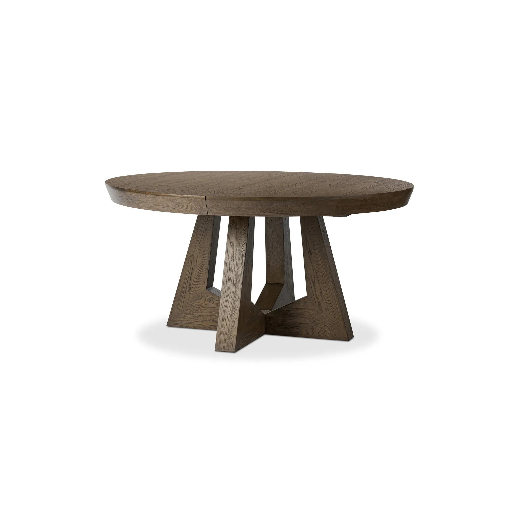 Sculptural angles define this expansive oak dining table, as angled cutouts play up a tapered base and top. Expandable design includes two leaves, easily extending from 77" to 94", for intimate gatherings and dinner parties alike Amethyst Home provides interior design, new home construction design consulting, vintage area rugs, and lighting in the Boston metro area.