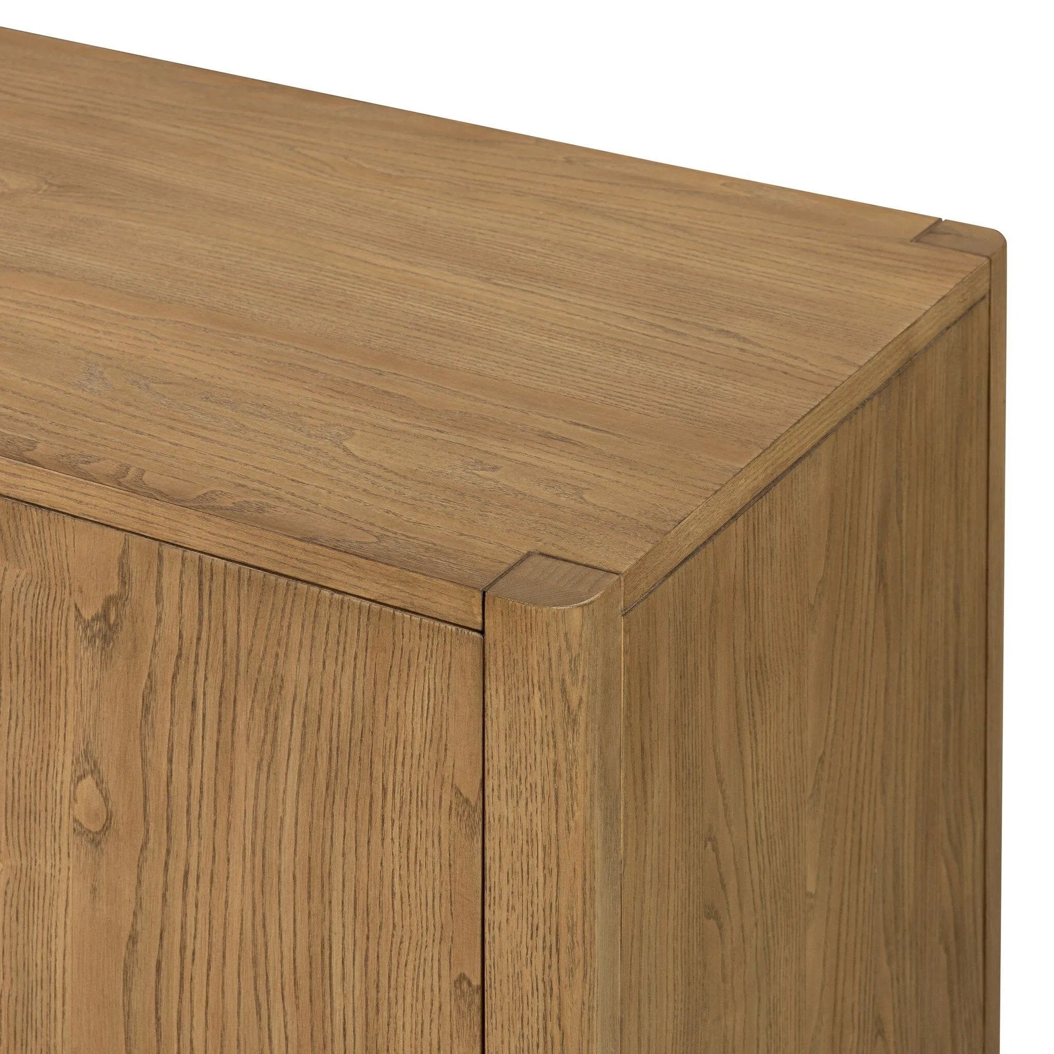 Simple yet refined, a Danish design-influenced sideboard is made from light-finished ash, with iron hardware finished in a sleek gunmetal. Perfect for larger spaces, with six doors and generous interior storage. Stretcher-style shelving made from woven paper cord serves up a textural finishing touch. Amethyst Home provides interior design, new home construction design consulting, vintage area rugs, and lighting in the Austin metro area.