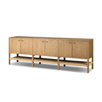 Simple yet refined, a Danish design-influenced sideboard is made from light-finished ash, with iron hardware finished in a sleek gunmetal. Perfect for larger spaces, with six doors and generous interior storage. Stretcher-style shelving made from woven paper cord serves up a textural finishing touch. Amethyst Home provides interior design, new home construction design consulting, vintage area rugs, and lighting in the Kansas City metro area.