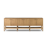 Simple yet refined, a Danish design-influenced sideboard is made from light-finished ash, with iron hardware finished in a sleek gunmetal. Perfect for larger spaces, with six doors and generous interior storage. Stretcher-style shelving made from woven paper cord serves up a textural finishing touch. Amethyst Home provides interior design, new home construction design consulting, vintage area rugs, and lighting in the Salt Lake City metro area.