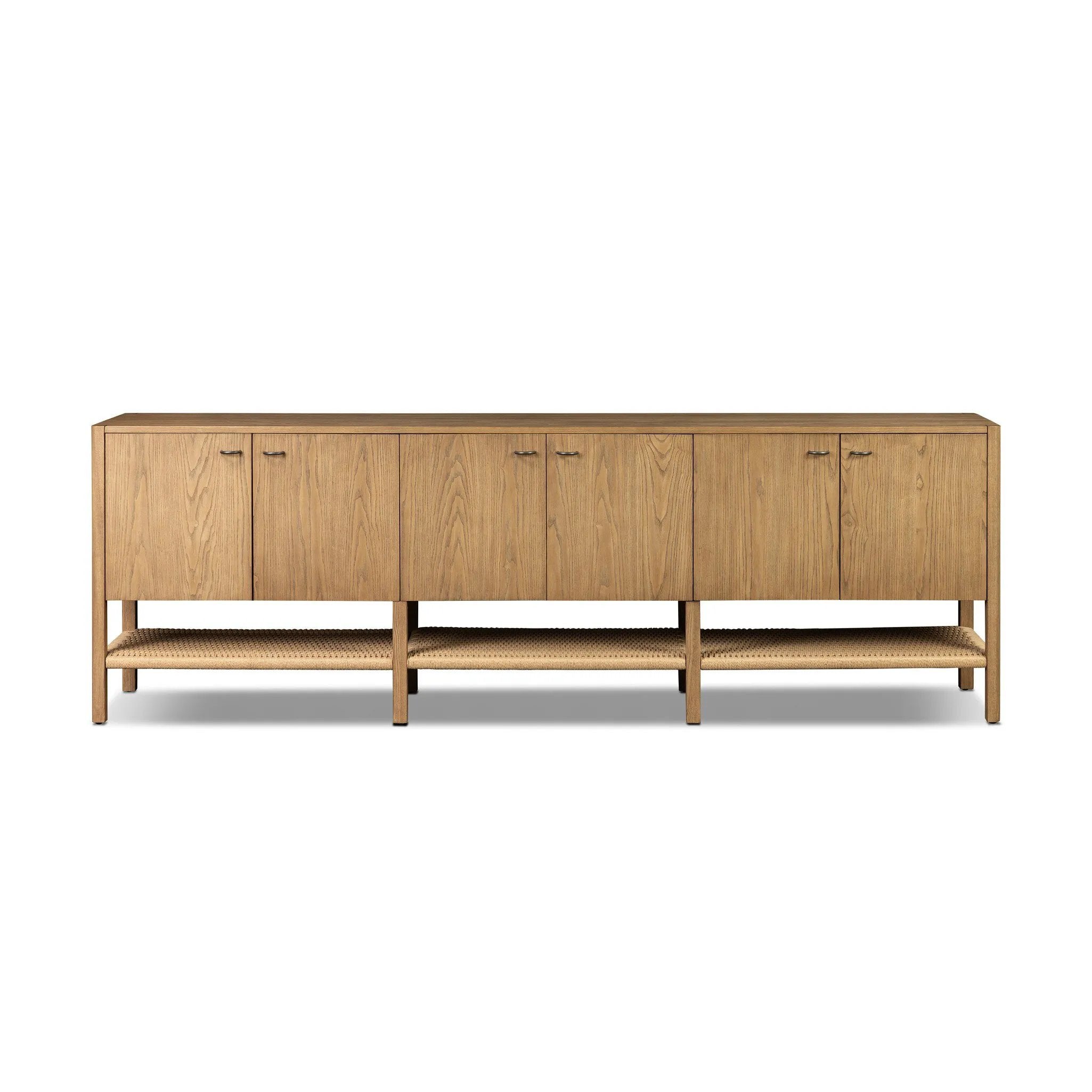 Simple yet refined, a Danish design-influenced sideboard is made from light-finished ash, with iron hardware finished in a sleek gunmetal. Perfect for larger spaces, with six doors and generous interior storage. Stretcher-style shelving made from woven paper cord serves up a textural finishing touch. Amethyst Home provides interior design, new home construction design consulting, vintage area rugs, and lighting in the Salt Lake City metro area.