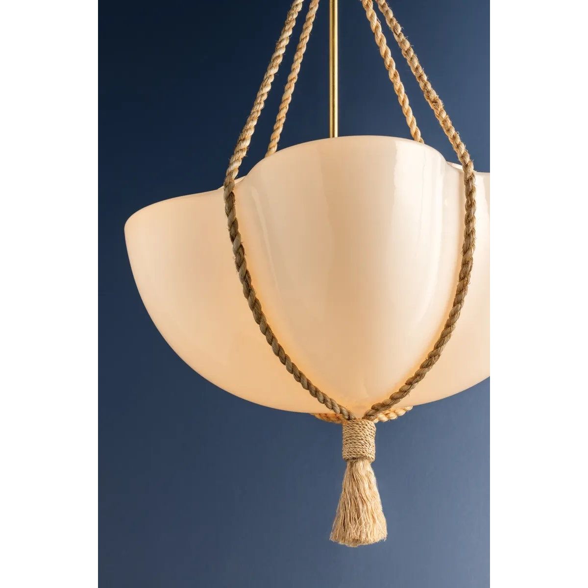 Celebrating the beauty of natural materials, the sophisticated Amberley pendant features a unique natural rope suspension and ethereal opal matte glass shade. Resembling a quatrefoil shape from above, the shade has four scalloped edges that nod to its botanical underpinnings. Amethyst Home provides interior design, new home construction design consulting, vintage area rugs, and lighting in the San Diego metro area.