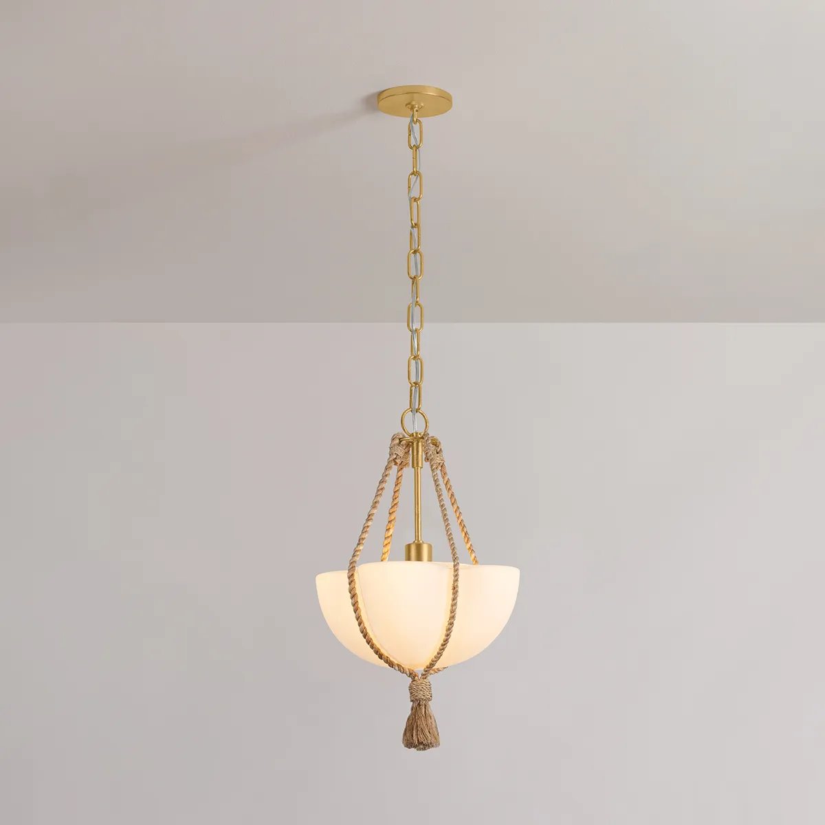 Celebrating the beauty of natural materials, the sophisticated Amberley pendant features a unique natural rope suspension and ethereal opal matte glass shade. Resembling a quatrefoil shape from above, the shade has four scalloped edges that nod to its botanical underpinnings. Amethyst Home provides interior design, new home construction design consulting, vintage area rugs, and lighting in the Tampa metro area.