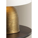 Made in India, Arvin introduces textural depth and warmth to a classic lamp form. There’s a noticeable play of light and shadow across the ridged surface of the domed base, creating movement and dimension. Patina Brass fittings and an off-white linen shade complement the earthy lamp base. Amethyst Home provides interior design, new home construction design consulting, vintage area rugs, and lighting in the Houston metro area.