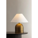 Made in India, Arvin introduces textural depth and warmth to a classic lamp form. There’s a noticeable play of light and shadow across the ridged surface of the domed base, creating movement and dimension. Patina Brass fittings and an off-white linen shade complement the earthy lamp base. Amethyst Home provides interior design, new home construction design consulting, vintage area rugs, and lighting in the Washington metro area.