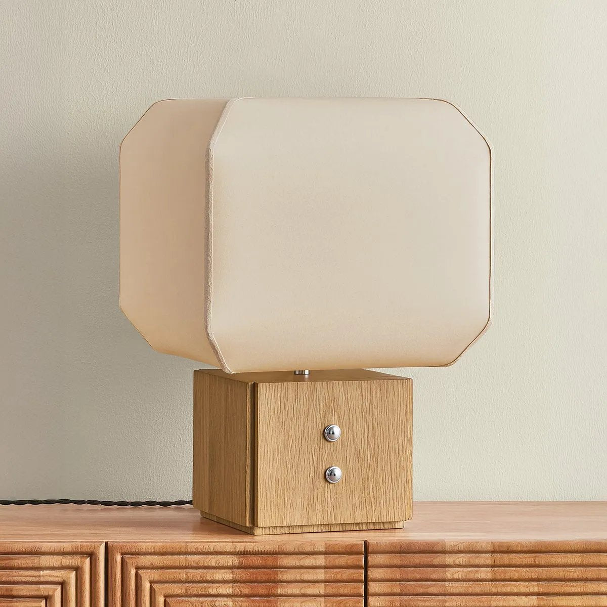 Brice is a study in contrast—pairing lightness and structure through a sculptural, design-forward silhouette. A handmade paper voluminous shade, appears to gently billow from its solid white oak base, evoking a sense of quiet movement. Decorative Polished Nickel buttons lend a subtle detail that elevates the piece with just the right edge Amethyst Home provides interior design, new home construction design consulting, vintage area rugs, and lighting in the Des Moines metro area.