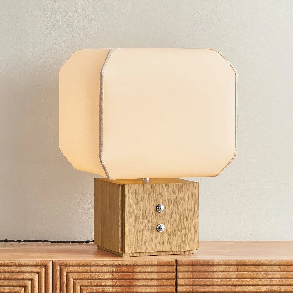 Brice is a study in contrast—pairing lightness and structure through a sculptural, design-forward silhouette. A handmade paper voluminous shade, appears to gently billow from its solid white oak base, evoking a sense of quiet movement. Decorative Polished Nickel buttons lend a subtle detail that elevates the piece with just the right edge Amethyst Home provides interior design, new home construction design consulting, vintage area rugs, and lighting in the Newport Beach metro area.