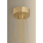 Playing with the concept of jewelry as installation, Bunda mixes structure and fluidity to create eye-catching drama. Finished in Vintage Brass, delicate rope chains dangle and loop across the streamlined arms of this 3- or 9-light chandelier. Amethyst Home provides interior design, new home construction design consulting, vintage area rugs, and lighting in the Miami metro area.
