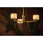 Playing with the concept of jewelry as installation, Bunda mixes structure and fluidity to create eye-catching drama. Finished in Vintage Brass, delicate rope chains dangle and loop across the streamlined arms of this 3- or 9-light chandelier. Amethyst Home provides interior design, new home construction design consulting, vintage area rugs, and lighting in the Monterey metro area.