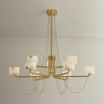 Playing with the concept of jewelry as installation, Bunda mixes structure and fluidity to create eye-catching drama. Finished in Vintage Brass, delicate rope chains dangle and loop across the streamlined arms of this 3- or 9-light chandelier. Amethyst Home provides interior design, new home construction design consulting, vintage area rugs, and lighting in the Portland metro area.