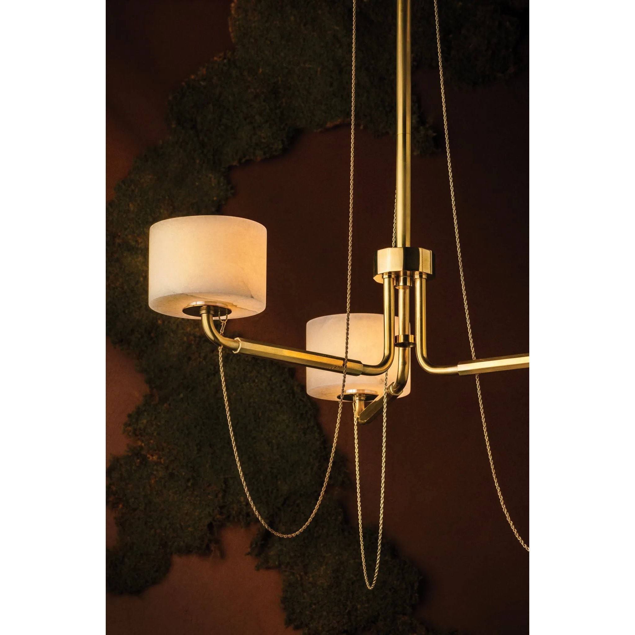 Playing with the concept of jewelry as installation, Bunda mixes structure and fluidity to create eye-catching drama. Finished in Vintage Brass, delicate rope chains dangle and loop across the streamlined arms of this 3- or 9-light chandelier. Amethyst Home provides interior design, new home construction design consulting, vintage area rugs, and lighting in the Salt Lake City metro area.