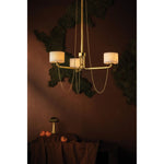 Playing with the concept of jewelry as installation, Bunda mixes structure and fluidity to create eye-catching drama. Finished in Vintage Brass, delicate rope chains dangle and loop across the streamlined arms of this 3- or 9-light chandelier. Amethyst Home provides interior design, new home construction design consulting, vintage area rugs, and lighting in the San Diego metro area.
