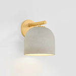 Inspired by Neoclassical architecture, Cara uses a domed shade and textural ceramic finish for a sconce that feels both ancient and new. A matte reactive glaze in an creamy hue creates a subtle surface grain that imitates natural stone. A circular modern armback in an Aged Brass finish adds shine to the fixture.  Amethyst Home provides interior design, new home construction design consulting, vintage area rugs, and lighting in the Charlotte metro area.