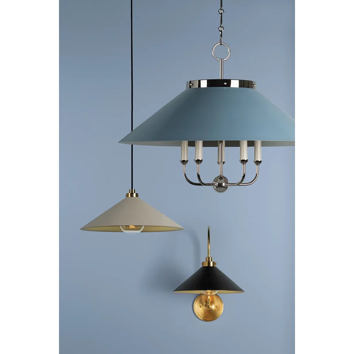 This classic metal shade design feels special with fresh finish combinations and sleek, heritage-inspired details. The contrastiing Aged Brass accents and modern gooseneck arm allow the pendants and sconce an updated, yet classic feel. The tapered shade over a five-light candelabra give the chandelier new traditional appeal. Amethyst Home provides interior design, new home construction design consulting, vintage area rugs, and lighting in the Laguna Beach metro area.