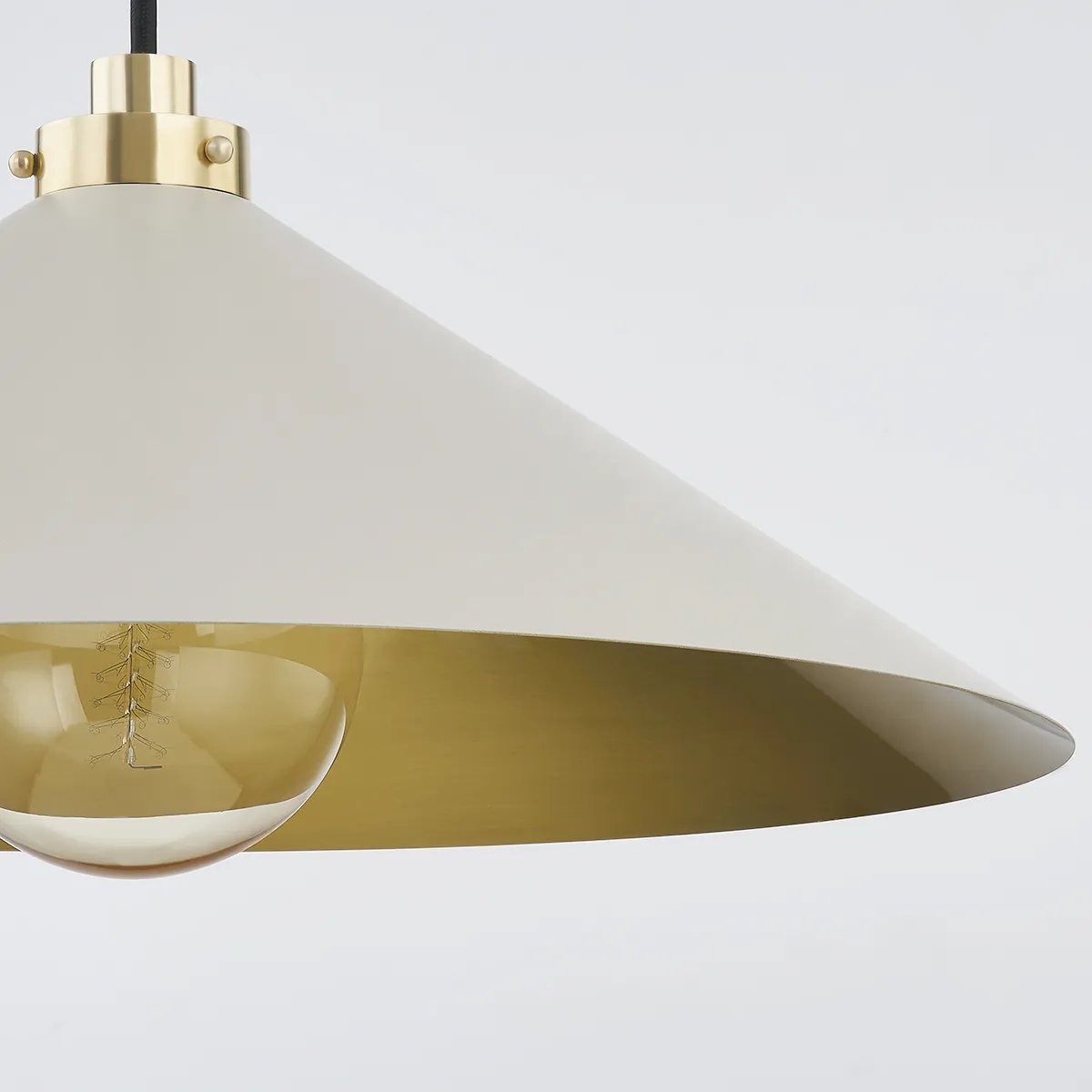 This classic metal shade design feels special with fresh finish combinations and sleek, heritage-inspired details. The contrastiing Aged Brass accents and modern gooseneck arm allow the pendants and sconce an updated, yet classic feel. The tapered shade over a five-light candelabra give the chandelier new traditional appeal. Amethyst Home provides interior design, new home construction design consulting, vintage area rugs, and lighting in the Omaha metro area.