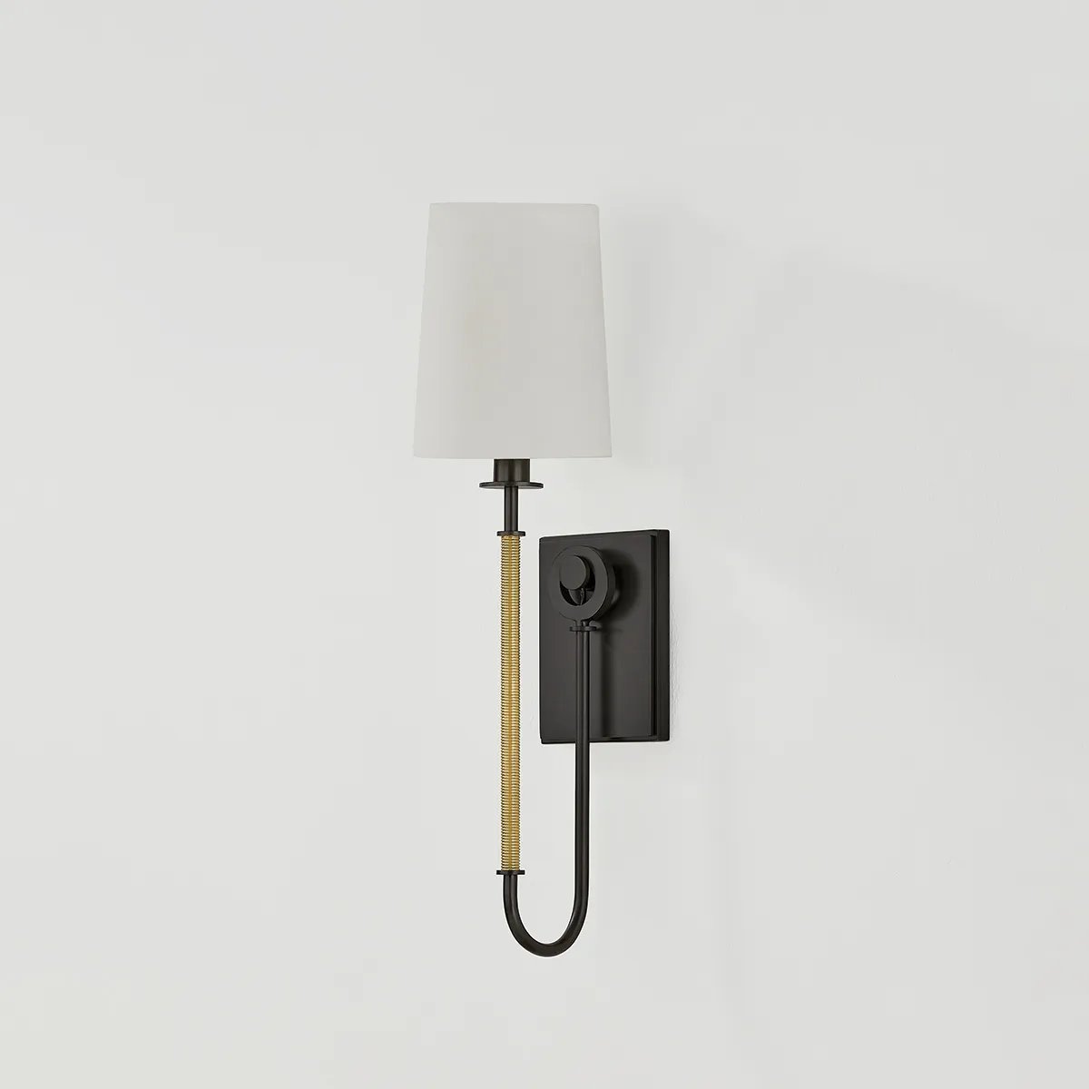The antique-inspired silhouette of the Glenmont sconce is slender and refined with machine-led hardware. Each stem features a horizontal knurl resembling a screw, adding texture and a contemporary feel to the fixture. Amethyst Home provides interior design, new home construction design consulting, vintage area rugs, and lighting in the Seattle metro area.
