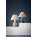 Artisanal and contemporary, Hanslope features a gracefully sculpted ceramic base paired with a crisp white linen shade. The unique form and proportions, coupled with the off-white French Muslin glaze give this lamp an earthy, organic feel. The glossy finish adds to the charm of this lovely everyday light fixture Amethyst Home provides interior design, new home construction design consulting, vintage area rugs, and lighting in the Tampa metro area.