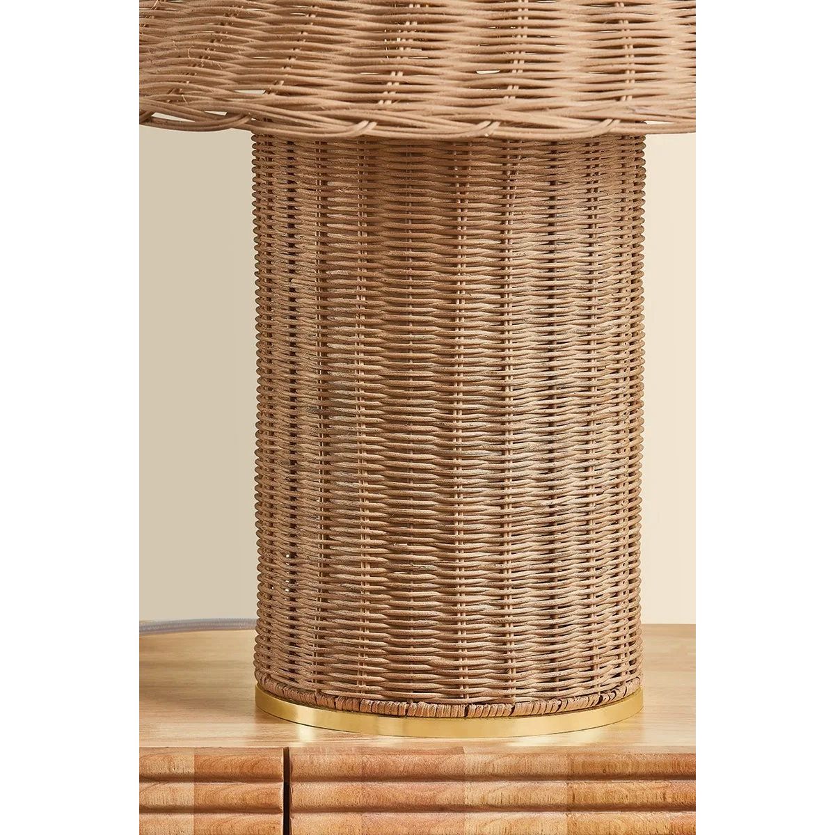 Woven from natural wicker, the Jeanette table lamp channels the inviting spirit of cottagecore with a bold, sculptural silhouette. A textural shade rests on a matching body, with a rim of decorative Aged Brass glimmering at the base. Perfect for a console, end table, or bedside, Jeanette infuses any space with a dose of charm Amethyst Home provides interior design, new home construction design consulting, vintage area rugs, and lighting in the Laguna Beach metro area.