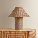 Woven from natural wicker, the Jeanette table lamp channels the inviting spirit of cottagecore with a bold, sculptural silhouette. A textural shade rests on a matching body, with a rim of decorative Aged Brass glimmering at the base. Perfect for a console, end table, or bedside, Jeanette infuses any space with a dose of charm Amethyst Home provides interior design, new home construction design consulting, vintage area rugs, and lighting in the Newport Beach metro area.