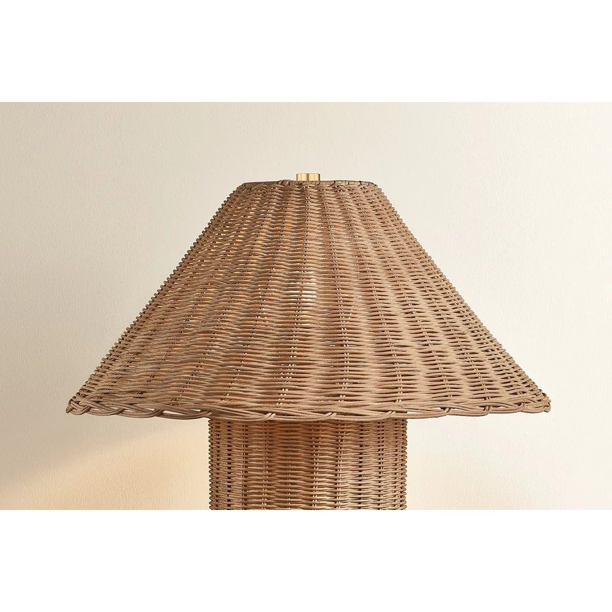Woven from natural wicker, the Jeanette table lamp channels the inviting spirit of cottagecore with a bold, sculptural silhouette. A textural shade rests on a matching body, with a rim of decorative Aged Brass glimmering at the base. Perfect for a console, end table, or bedside, Jeanette infuses any space with a dose of charm Amethyst Home provides interior design, new home construction design consulting, vintage area rugs, and lighting in the San Diego metro area.