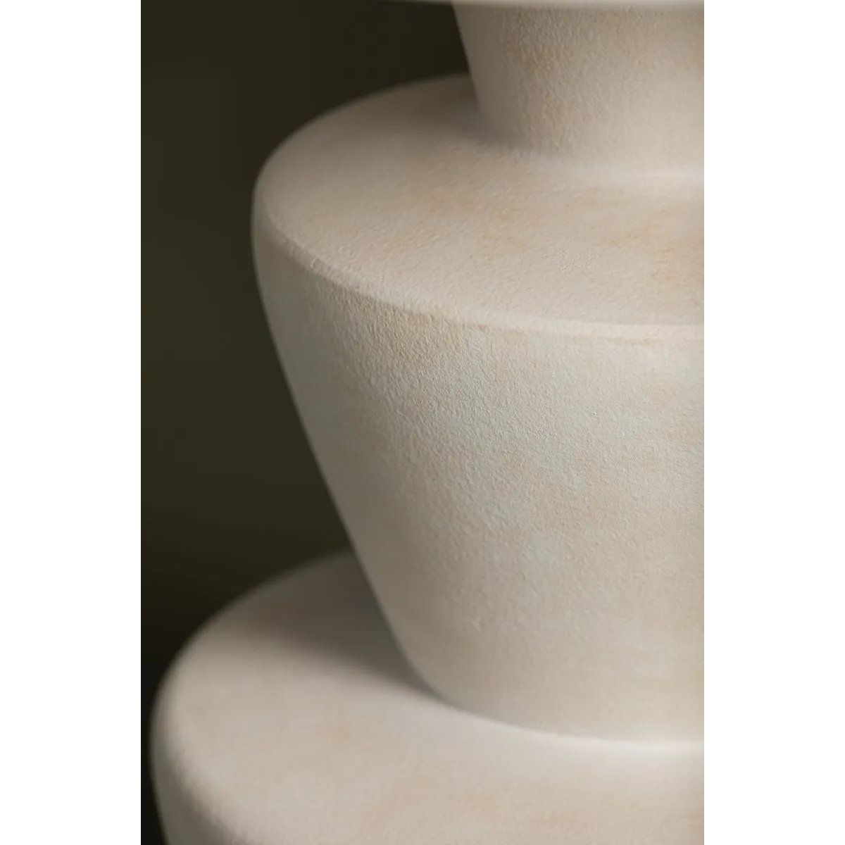 A series of three stacked, bowl-like shapes in ivory texture ceramic give this table lamp an organic, hand-crafted silhouette. The tapered off-white linen shade and Patina Brass accents add to the warm, natural beauty. Amethyst Home provides interior design, new home construction design consulting, vintage area rugs, and lighting in the Boston metro area.