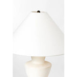 A series of three stacked, bowl-like shapes in ivory texture ceramic give this table lamp an organic, hand-crafted silhouette. The tapered off-white linen shade and Patina Brass accents add to the warm, natural beauty. Amethyst Home provides interior design, new home construction design consulting, vintage area rugs, and lighting in the Park City metro area.