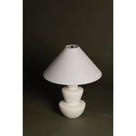 A series of three stacked, bowl-like shapes in ivory texture ceramic give this table lamp an organic, hand-crafted silhouette. The tapered off-white linen shade and Patina Brass accents add to the warm, natural beauty. Amethyst Home provides interior design, new home construction design consulting, vintage area rugs, and lighting in the Scottsdale metro area.