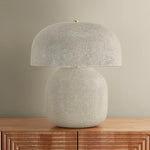 The Leetown lamp reimagines an iconic mushroom silhouette with playful proportions and a highly textured finish. Putting a modern spin on a traditional crackle glaze, ink is applied between the fractured plates to create a striking, graphic effect. Amethyst Home provides interior design, new home construction design consulting, vintage area rugs, and lighting in the Dallas metro area.