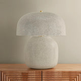 The Leetown lamp reimagines an iconic mushroom silhouette with playful proportions and a highly textured finish. Putting a modern spin on a traditional crackle glaze, ink is applied between the fractured plates to create a striking, graphic effect. Amethyst Home provides interior design, new home construction design consulting, vintage area rugs, and lighting in the Dallas metro area.