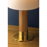 The Meadowbrook rechargeable lamp reinterprets a traditional silhouette with charming details. A beautifully grained light oak base rests upon a scalloped Aged Brass foot, introducing a graphic floral element. Topped with a classic white linen shade, the design balances decorative appeal with modern tailoring. Amethyst Home provides interior design, new home construction design consulting, vintage area rugs, and lighting in the Los Angeles metro area.