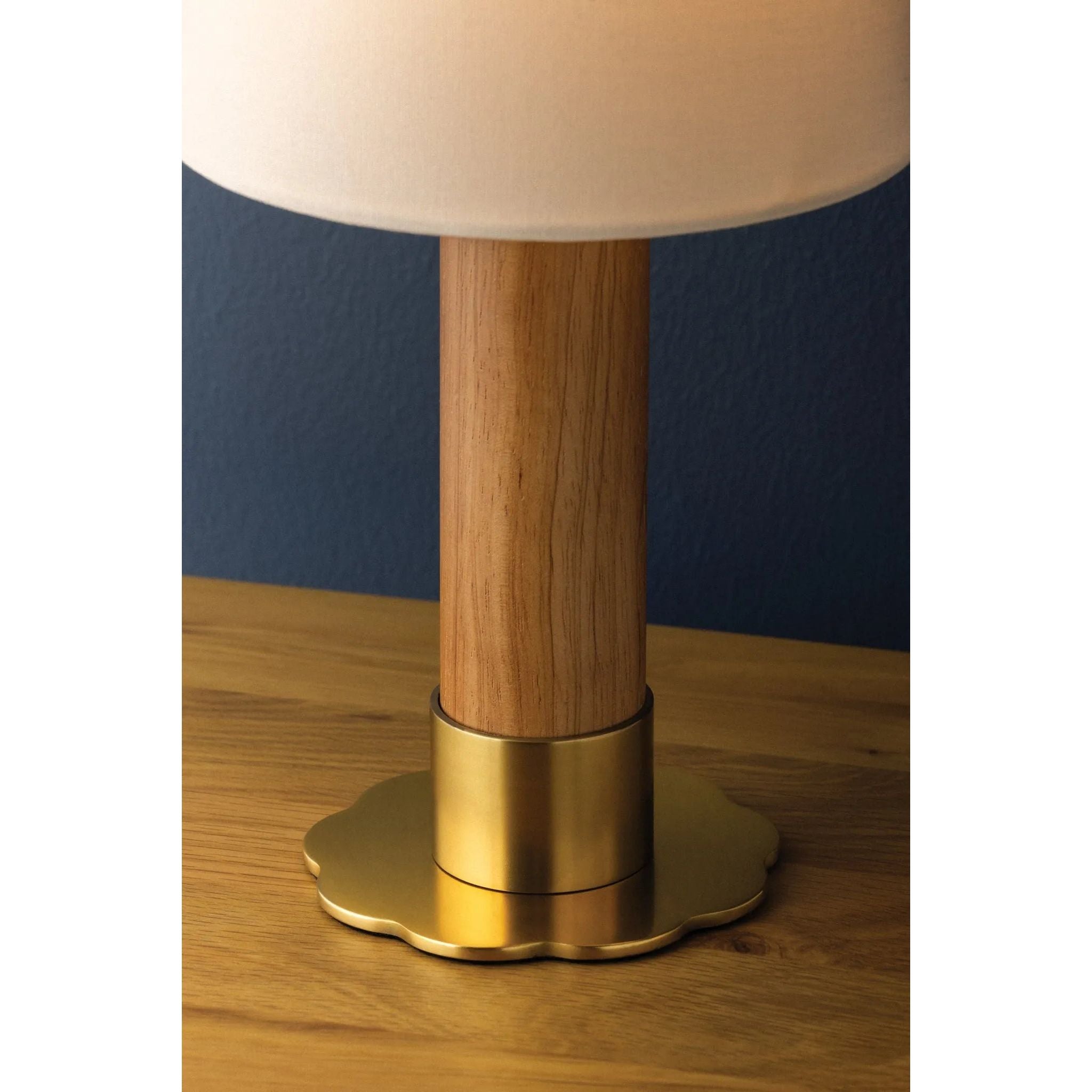 The Meadowbrook rechargeable lamp reinterprets a traditional silhouette with charming details. A beautifully grained light oak base rests upon a scalloped Aged Brass foot, introducing a graphic floral element. Topped with a classic white linen shade, the design balances decorative appeal with modern tailoring. Amethyst Home provides interior design, new home construction design consulting, vintage area rugs, and lighting in the Los Angeles metro area.