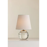 Ridged with ripple-like cuts, the crystal base of the Nicole table lamp makes for an eye-catching accent piece. Topped with a beautiful white linen shade, this pretty portable is rechargeable, adding convenience when styling. With classic Aged Brass-finished hardware, it’s the perfect addition to any bookshelf or small space. Amethyst Home provides interior design, new home construction design consulting, vintage area rugs, and lighting in the Austin metro area.