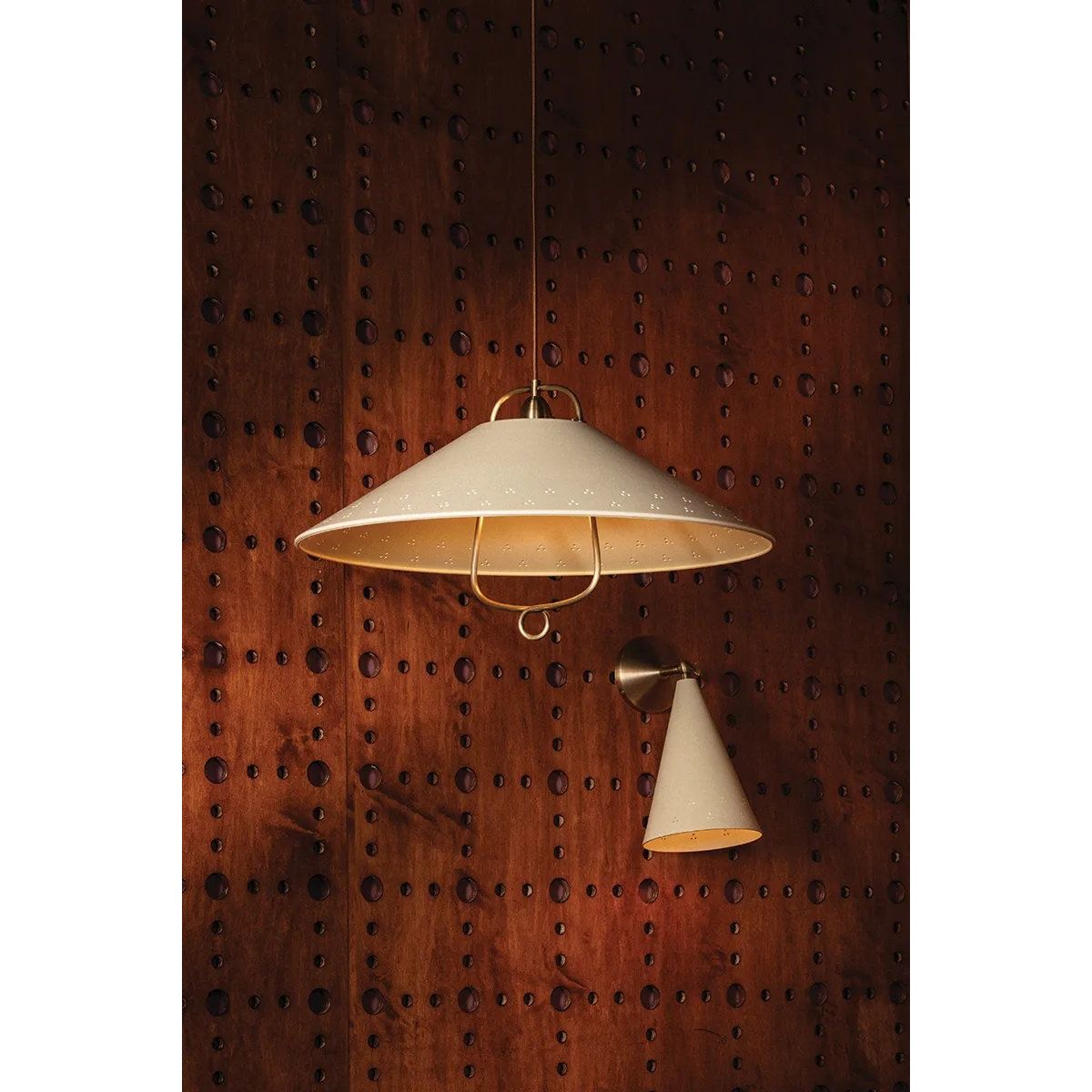 Drawing inspiration from the relaxed style of coastal villages, the Pawley family is carefree yet intentional. The pendant features graceful metalwork with a Historic Bronze finish, including a charming loop below the Soft Sand shade. With an adjustable swivel head, the sconce lets you direct light exactly where needed. Amethyst Home provides interior design, new home construction design consulting, vintage area rugs, and lighting in the Seattle metro area.