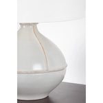 Inspired by rustic pottery, this table lamp's beautifully shaped base is crafted of pale sage ceramic giving it an earthy pale green tone. The off white linen shade pairs naturally and casts a soft glow. Raised seamlines and a reactive glaze that allows hints of the natural ceramic to peek through, give the fixture a hand-thrown, crafted feel. Amethyst Home provides interior design, new home construction design consulting, vintage area rugs, and lighting in the Salt Lake City metro area.