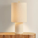The all-over soft ivory boucle of the Sam family of lamps creates an inviting addition to modern interiors. As a table lamp, Sam makes a minimalist statement on a sideboard, while the floor lamp warms up a bedroom or reading nook with ease. The playful vertical proportions of both the table and floor lamp make them ideal for more narrow spaces. Amethyst Home provides interior design, new home construction design consulting, vintage area rugs, and lighting in the Austin metro area.