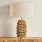 The lively Winbrook table lamp calls to mind the shape of a honeycomb. The voluminous base has been wrapped in natural pencil rattan, blending shape and material for a spin on the earthy, pillowy decor trend. Amethyst Home provides interior design, new home construction design consulting, vintage area rugs, and lighting in the Miami metro area.