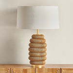 The lively Winbrook table lamp calls to mind the shape of a honeycomb. The voluminous base has been wrapped in natural pencil rattan, blending shape and material for a spin on the earthy, pillowy decor trend. Amethyst Home provides interior design, new home construction design consulting, vintage area rugs, and lighting in the Portland metro area.