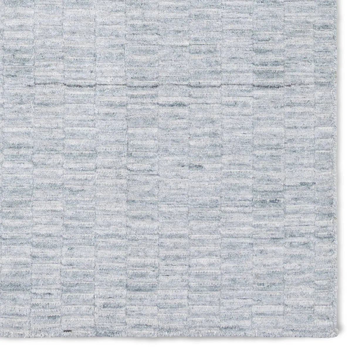 Made from 100% PET the indoor/ outdoor handwoven Roan Aaren is perfect for performance needs.  This pseudo-solid blue rug bodes a light checkered appearance with a neutral backdrop.ROA0 Amethyst Home provides interior design, new home construction design consulting, vintage area rugs, and lighting in the Dallas metro area.