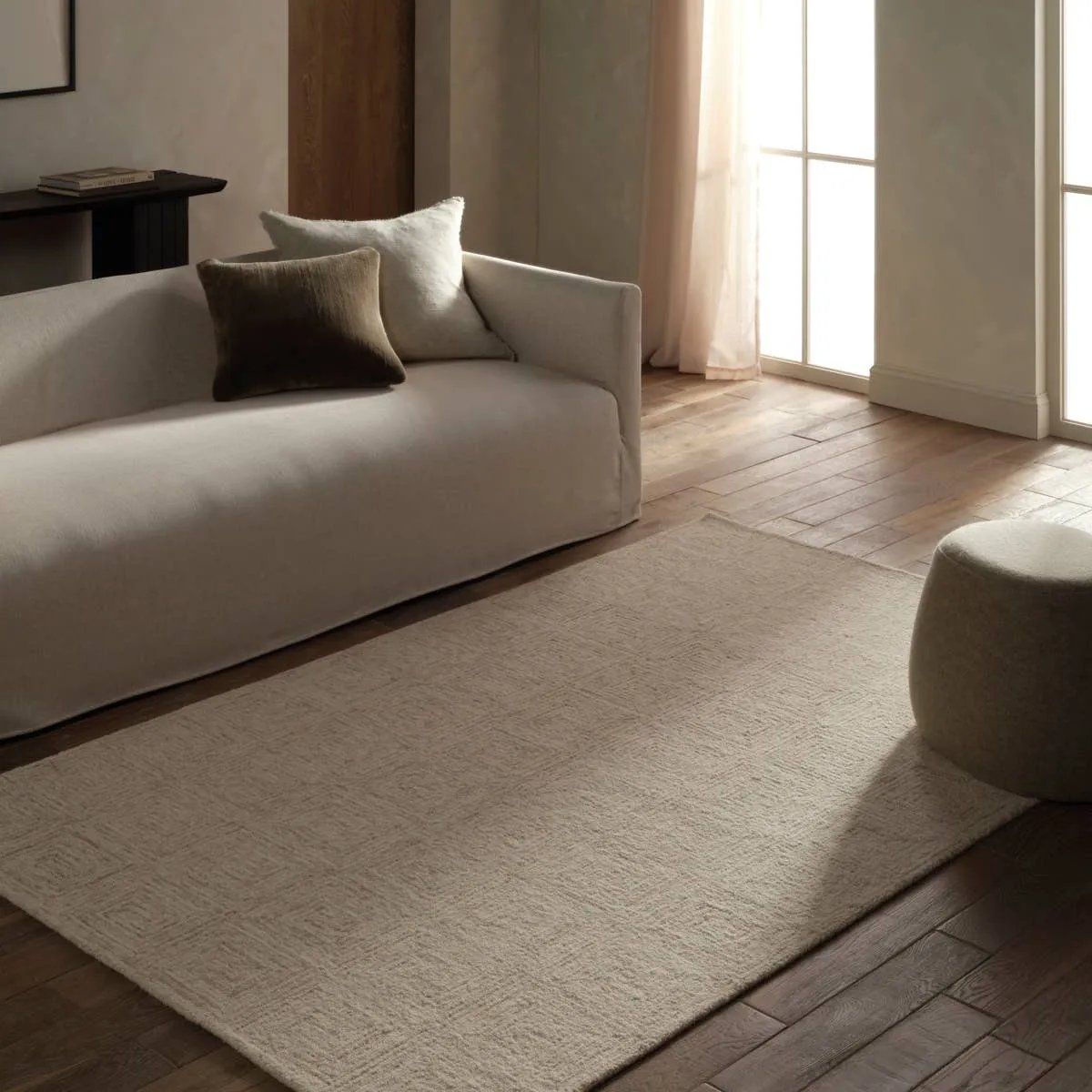 Featuring Kafes Aleric Rug by Jaipur Living at Amethyst Home. The Kafes Aleric embraces minimalist geometry with a modern, tranquil aesthetic. The Aleric design is tufted directionally to form strong, harmonious lines, creating concentric rectangles that radiate outward. Balancing structured design with natural fluidity, this breathable piece allows air to flow. Amethyst Home provides interior design, new home construction design consulting, vintage area rugs, and lighting in the Tampa metro area.