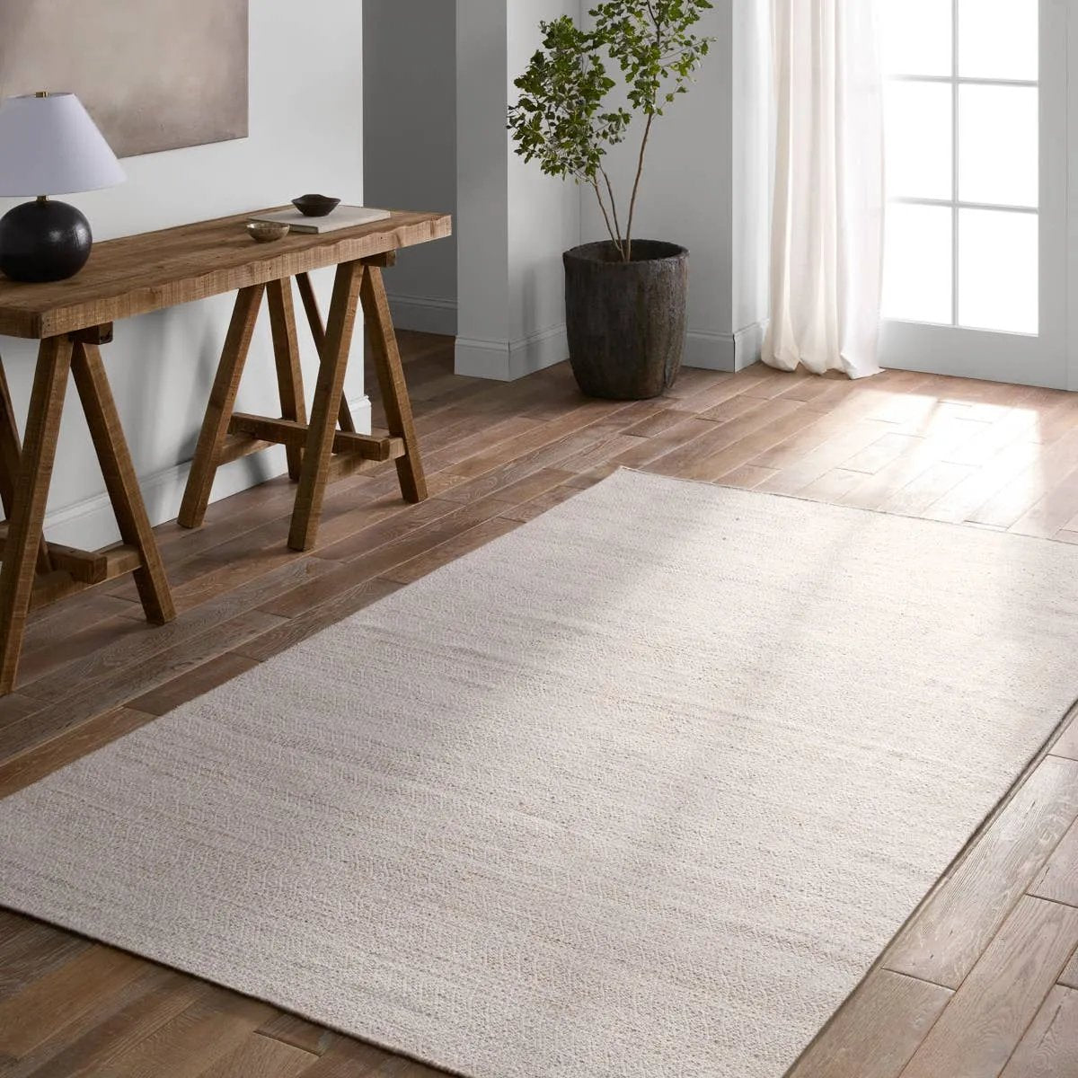 Handwoven of weather-resistant PET, the Almas Imogen delights with contemporary colorways and designs. The Imogen design showcases a diamond trellis pattern in a colorway of tan and cream. The variegated neutral hues provide a subtle distressed look that wears well over time. Amethyst Home provides interior design, new home construction design consulting, vintage area rugs, and lighting in the Kansas City metro area.